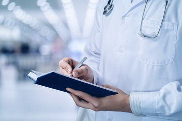 The doctor fills out a medical history .