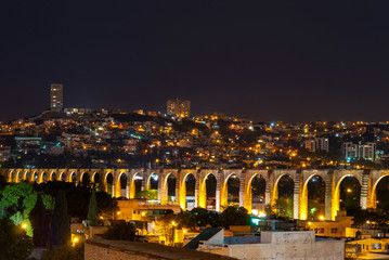 Fototapeta na wymiar Cityscape of Queretaro city at night with its famous Viaduct, Mexico.