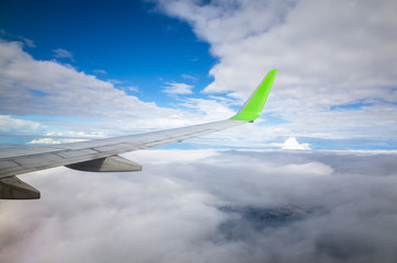Fototapeta na wymiar View from airplane window over cloud sky