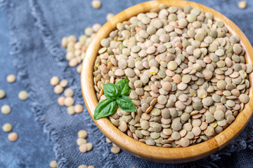 Brown organic dried lentils close up.