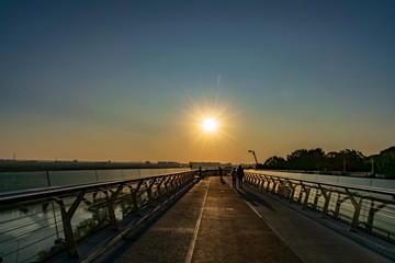 Fototapeta na wymiar bridge at sunrise