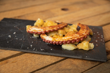 Octopus with paprika, potatoes and olive oil is a typical tapa from Galicia, Spain