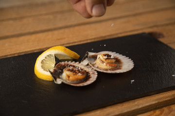 scallops with lemon, typical tapa in galicia spain