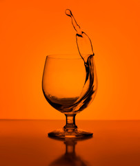 Splash of cognac in glass