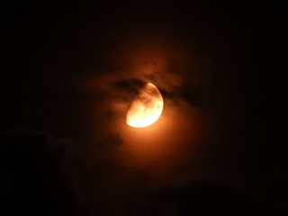Moon with clouds in the night sky.
