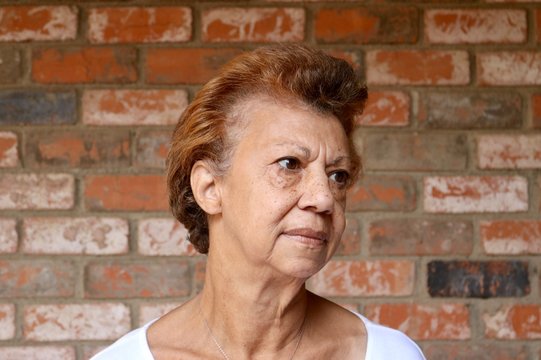 Portrait of a pensioner with a worried look and copy space