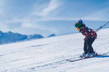 Child Skiing in the Mountains