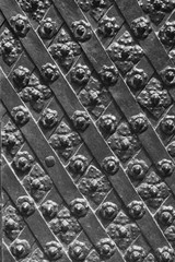 Black forged door, rhombus symmetrical texture