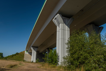 Highway bridge with blue sky near Kamenny Dvur village in summer morning