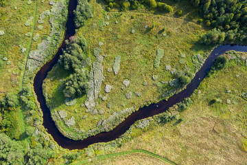 Obraz na płótnie Canvas Aerial view from drone on green summer forest, field and river