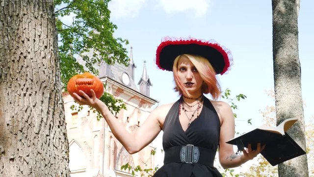witch casts spell book pumpkin  halloween magician paranormal
