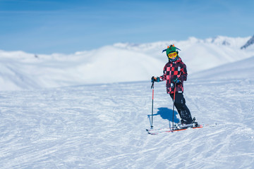 Fototapeta na wymiar Young Skier on Top of Ski Resort
