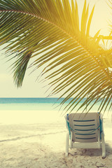 Chaise-longues in beach, travel card