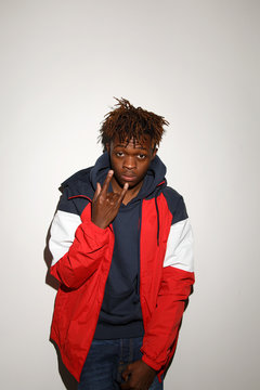 Black doubtful man in hood