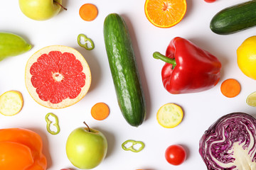 Different vegetables and fruits on white background, top view