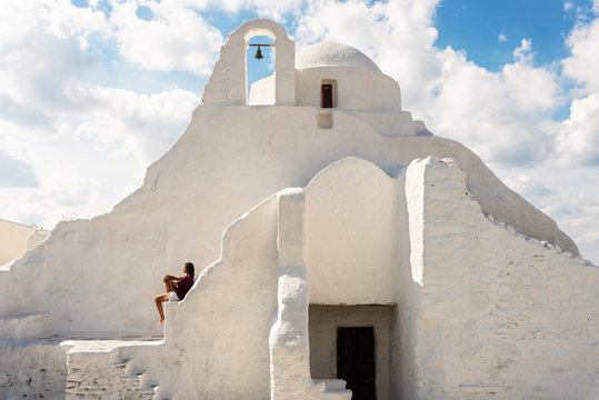 Woman sitting at the church, Mykonos