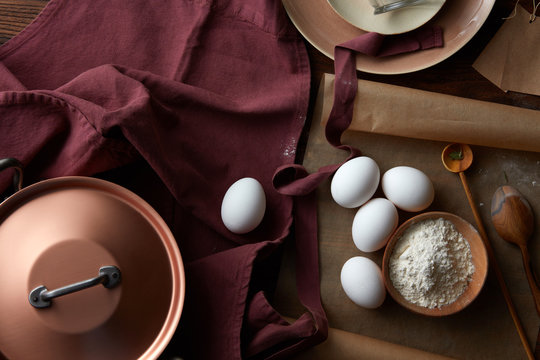Raw eggs with utensils
