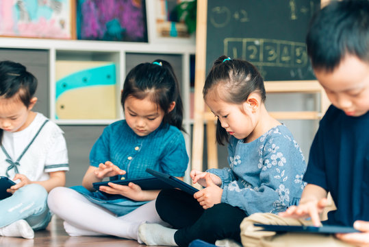 Students learning with digital tablets