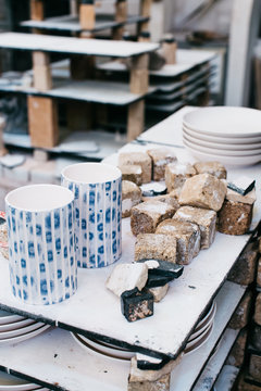 Ceramic Cups and Plates in Bright Artisan Pottery Studio