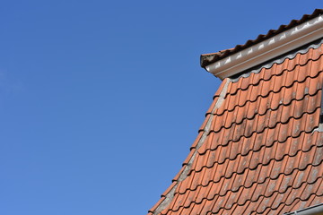 old tile roof against the sky