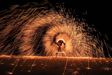 Koh Samet, Rayong, Thailand, 17 April 2019, beautiful fire circle spining show talent at night party beach island in thailand