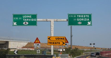 junction with road signs with the arrows with the detour for the