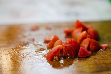 fresh sliced red tomatoes on a chalkboard