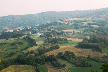 Fototapeta na wymiar Green Italian landscape. Italian hills. Emilia-Romagna, Italy, Europe.