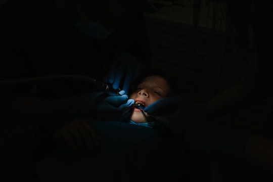 Dentist working on child teeth