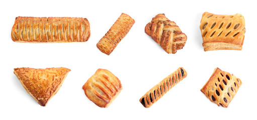 Set of fresh delicious puff pastries on white background, top view