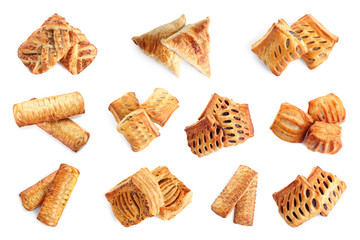 Set of fresh delicious puff pastries on white background, top view