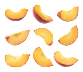 Naklejka na ściany i meble Set of cut fresh juicy peaches on white background