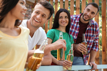 Young people enjoying picnic on summer day