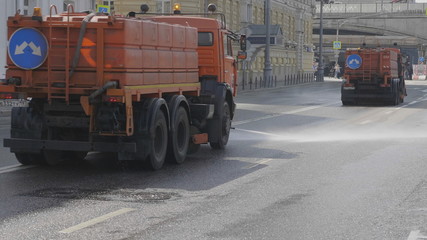 MOSCOW - JULE 25: n the city street works a watering machine on Jule 25, 2019 in Moscow, Russia