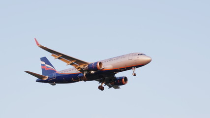 MOSCOW , RUSSIA, June 10, 2019: The Commercial passenger airplane flying overhead on sunny day on June 10, 2019 in Moscow, Russia