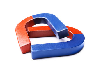 Red and blue horseshoe magnets on white background