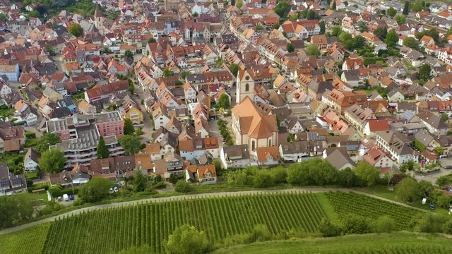 Aerial view of the city Endingen am Kaiserstuhl in germany on a sunny day in summer. Pan to the left from the back of the town.
