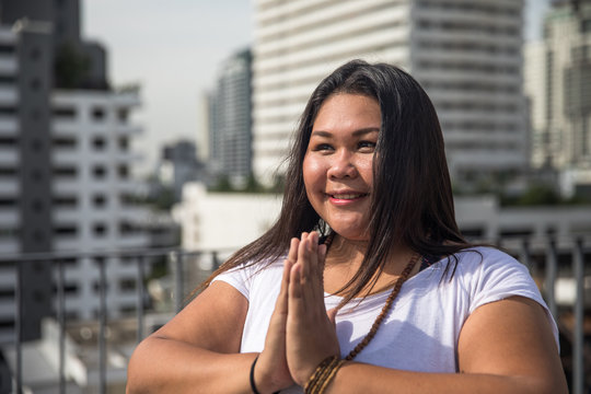 Portrait of Woman Performing Salutation Seal