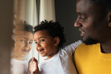 Happy father and his daughter having fun at home.