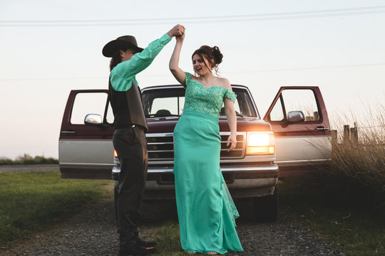 teenage couple having fun on way to high school prom