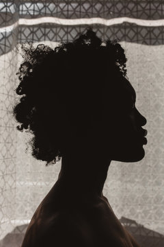 Silhouette of a young black woman
