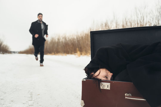 Woman in suitcase