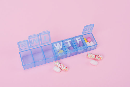 Pill box and colorful pills
