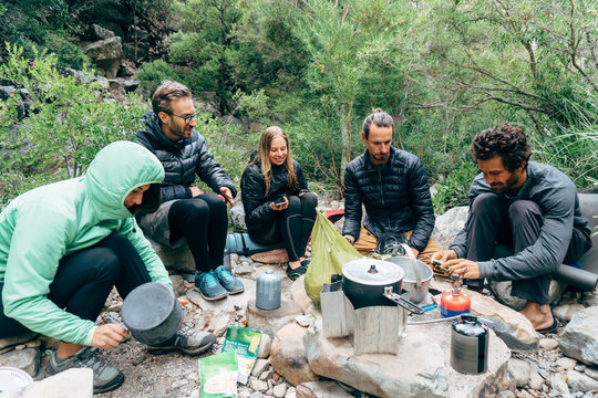 Hikers in wilderness camp - Powered by Adobe