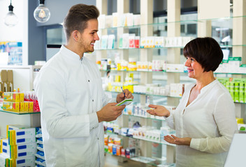 pharmacist  helping customer