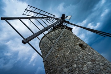 old windmill on background of blue sky