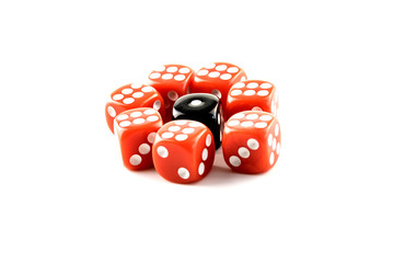 Black dice surrounded by red dice on white background. One against all.