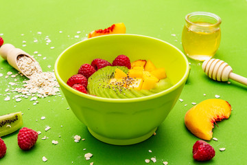 Oatmeal bowl with fresh berries and fruits