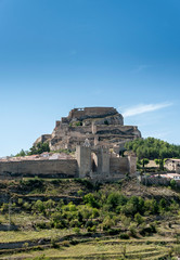 View of the medieval walled city and the castle of Morella, in Spain.