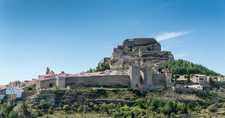 View of the medieval walled city and the castle of Morella, in Spain.